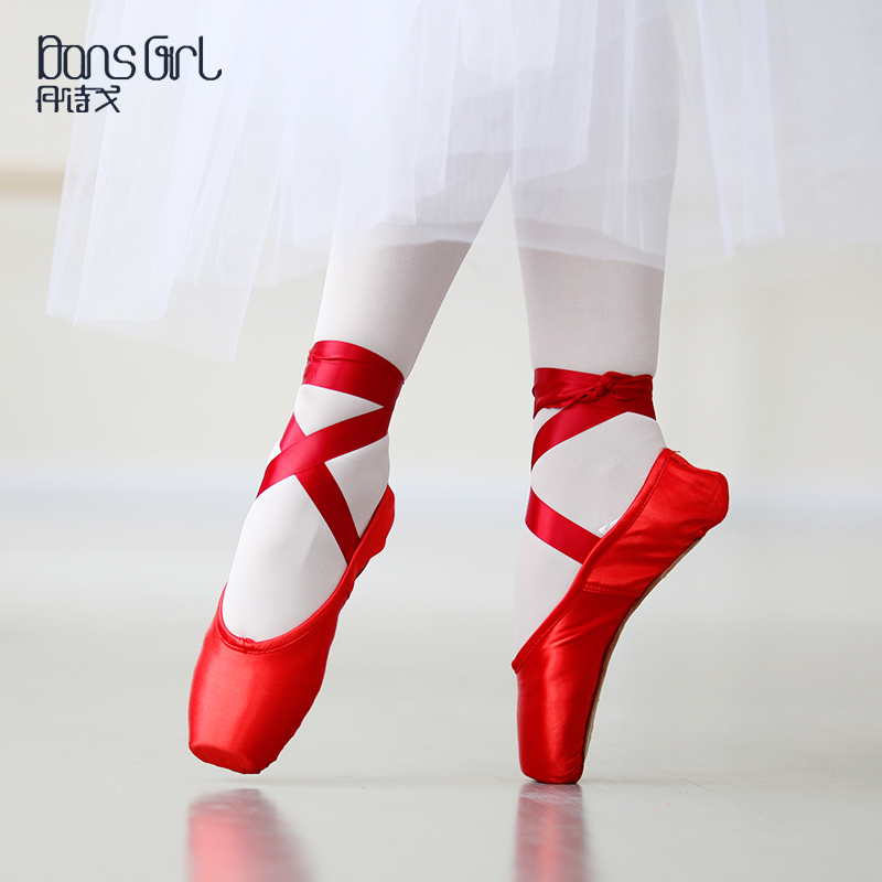 red ballet shoes with ribbons